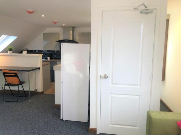 Bright and modern kitchen area featuring a clea...