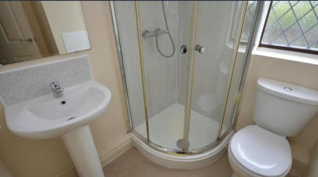 A well-maintained bathroom featuring a modern s...