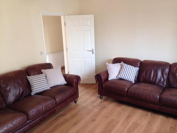 A cozy living room featuring two comfortable br...