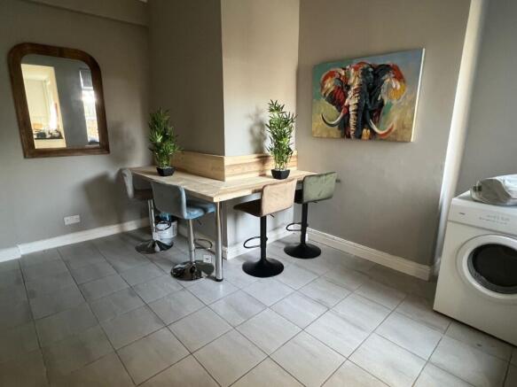 A modern communal workspace featuring a corner ...
