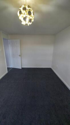 A clean, well-maintained bedroom with neutral w...