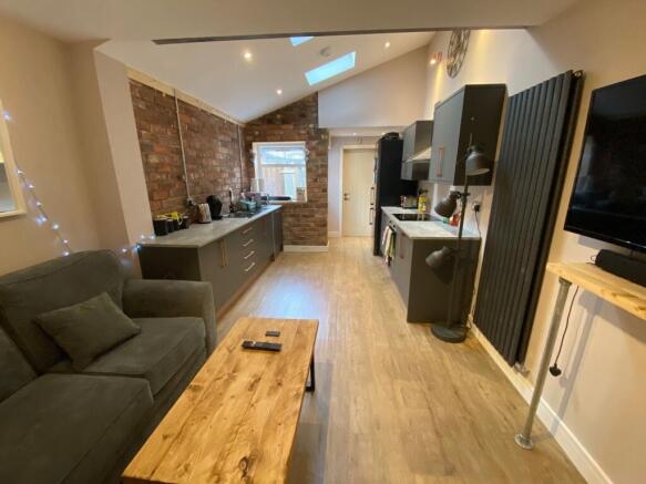 A spacious and modern living room with contempo...