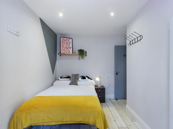 A stylish and inviting double bedroom featuring...