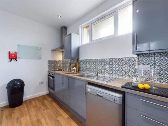 A modern and well-equipped kitchenette featurin...