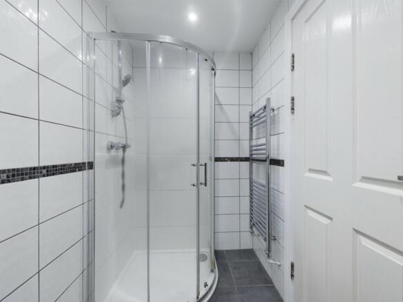 A modern and immaculate bathroom featuring a sp...
