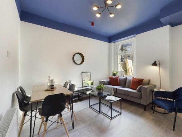 Bright and modern living room with stylish furn...