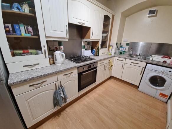 A well-maintained kitchen with ample counter sp...