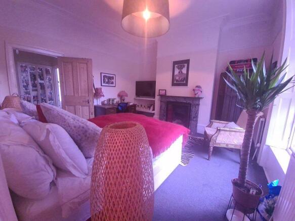 A bright and spacious living room featuring com...