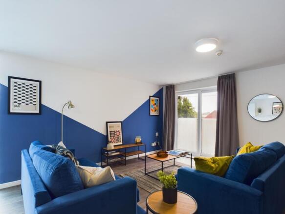 A spacious and inviting large modern living roo...