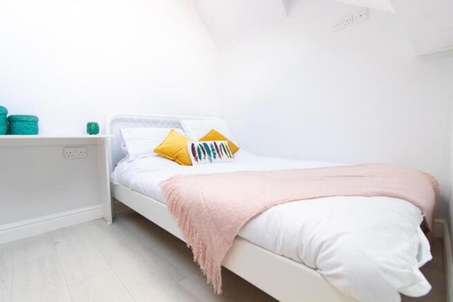 A bright and cozy double bedroom, perfect for s...