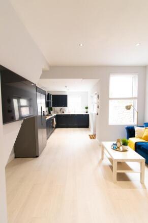 A spacious and modern living room with ample na...