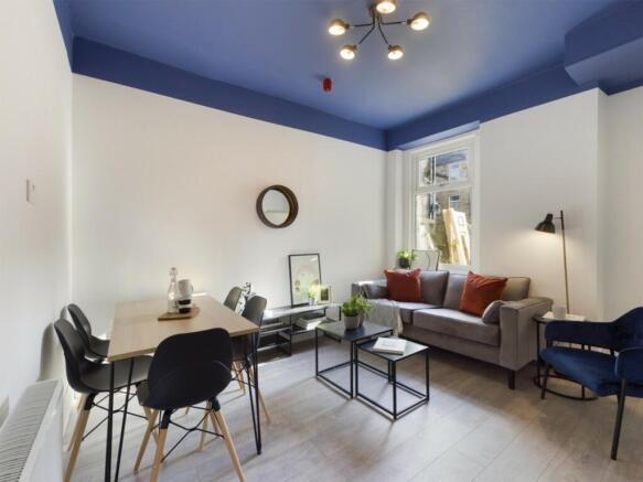 A bright and inviting large modern living room,...