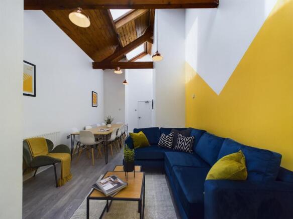 A stylish and spacious modern living room, perf...