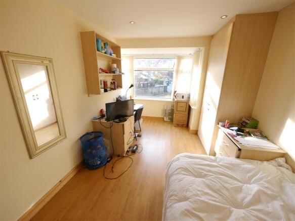 Bright and comfortable master bedroom featuring...