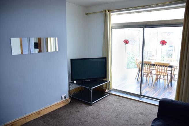 Bright and welcoming living room with a large s...