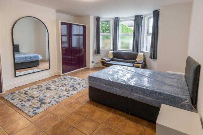 Bright and welcoming living room featuring larg...