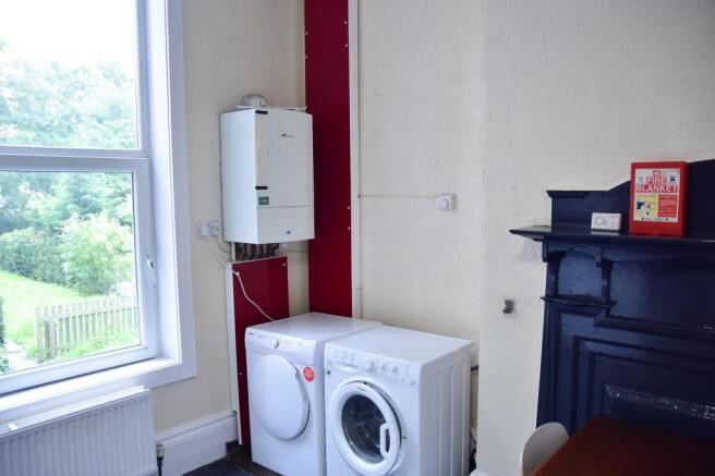 A functional kitchen area with a washing machin...