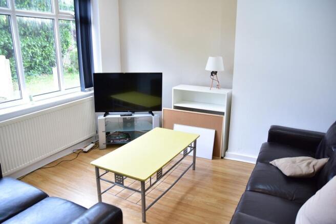 Bright and welcoming living room featuring a la...