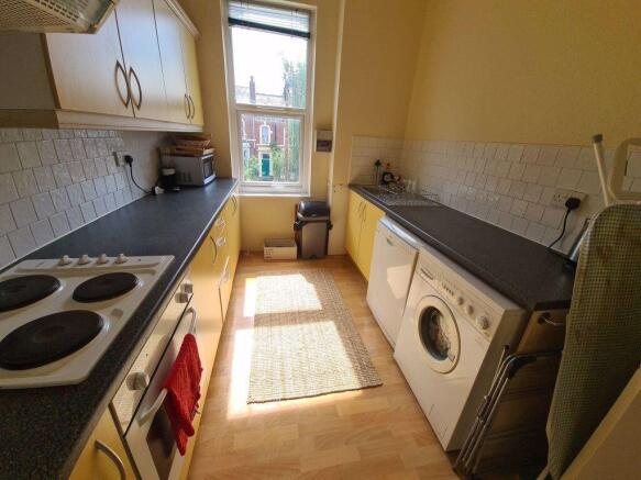A well-lit, tidy kitchen with modern appliances...