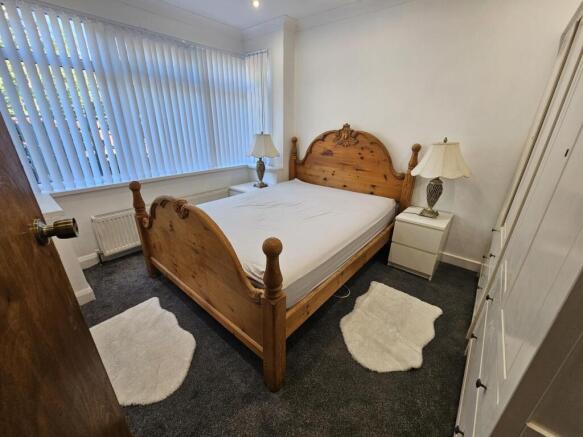 A spacious and well-maintained master bedroom f...