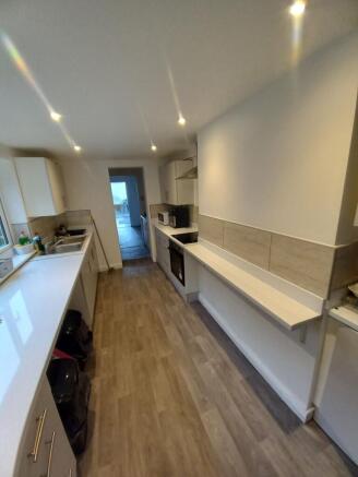 Bright and modern kitchen with ample counter sp...