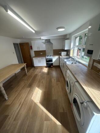 Bright and modern kitchen with ample counter sp...