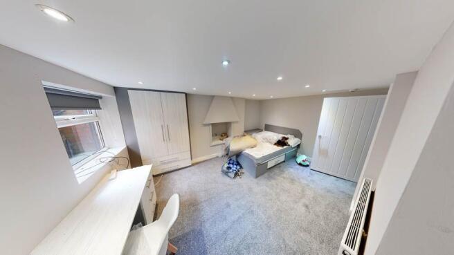 Bright and spacious living room featuring comfo...