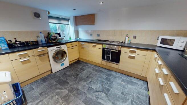 Bright and well-organized kitchen featuring amp...
