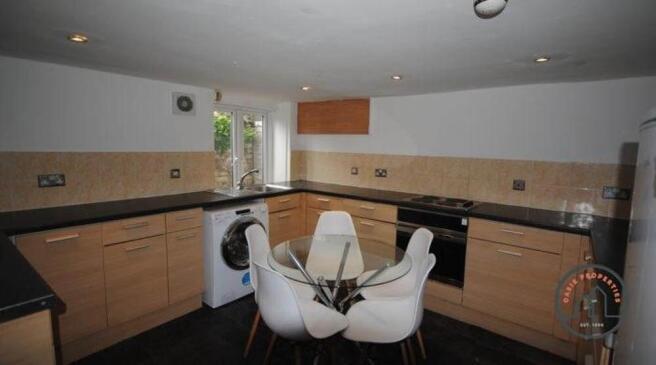 Modern kitchen featuring ample counter space, a...