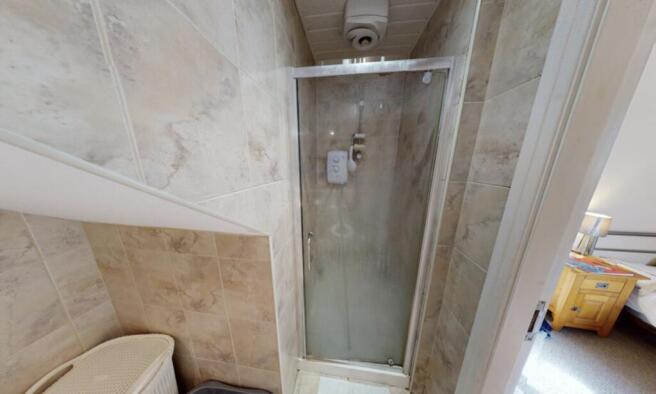 A clean and modern bathroom featuring a spaciou...