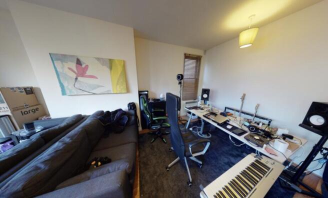 A contemporary living room featuring a large so...