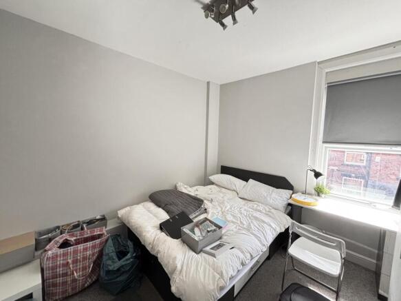 Bright and spacious master bedroom featuring a ...