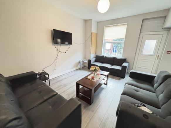 A bright and inviting living room featuring com...