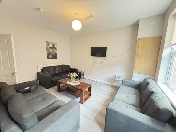 Bright and spacious living room featuring cozy ...