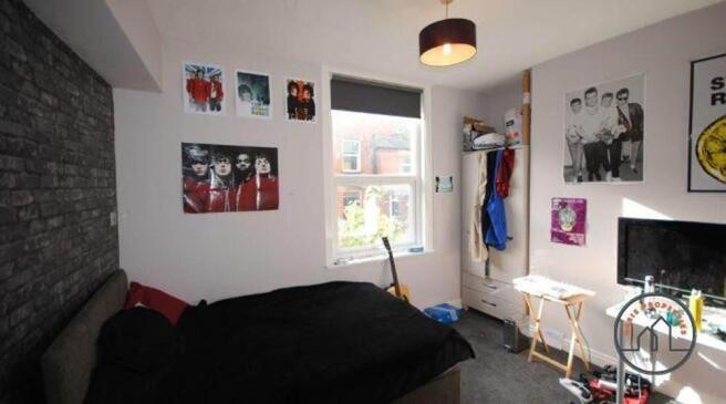 A well-lit, contemporary living room featuring ...