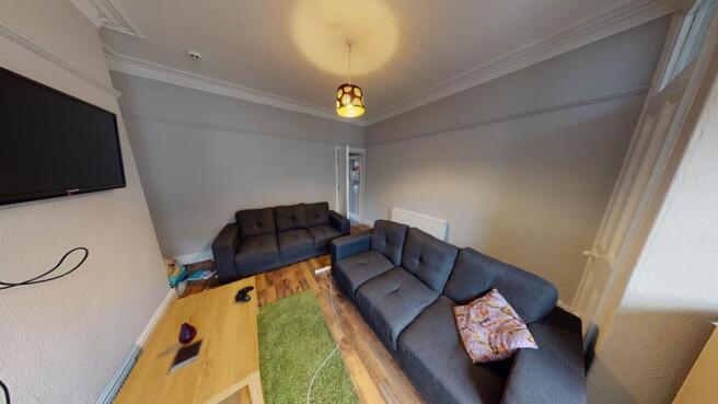 Spacious and well-lit modern living room featur...