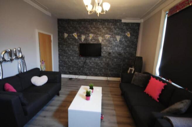 Modern and cozy living room featuring a black s...