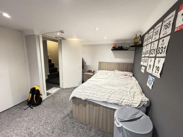 Spacious master bedroom with a comfortable doub...