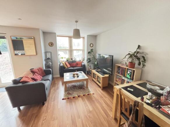 Bright and welcoming living room featuring comf...