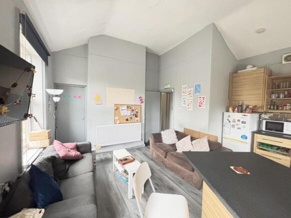 A bright and spacious living room with modern f...