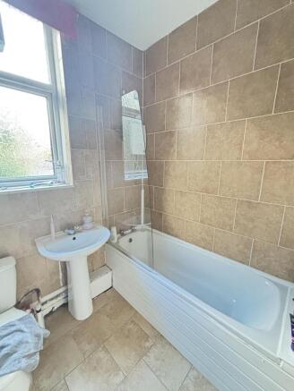 A clean and well-maintained bathroom featuring ...