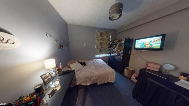 A spacious and inviting master bedroom featurin...