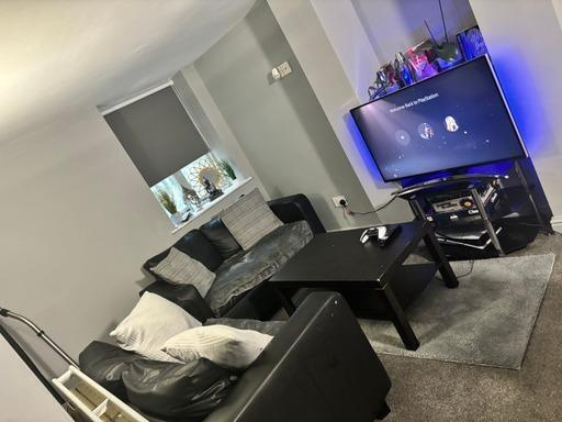 A modern, well-maintained living room featuring...