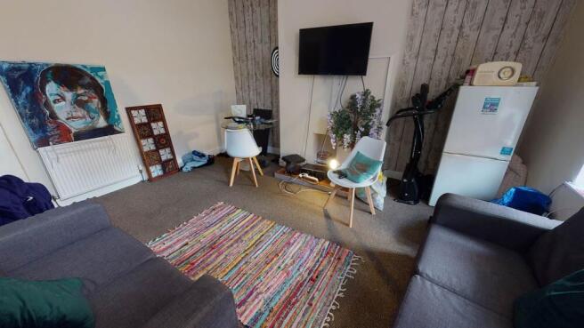 A contemporary living room featuring a large so...