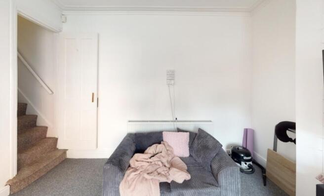 A modern living room with a comfortable sofa an...