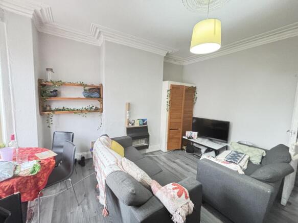 Bright and welcoming living room featuring comf...