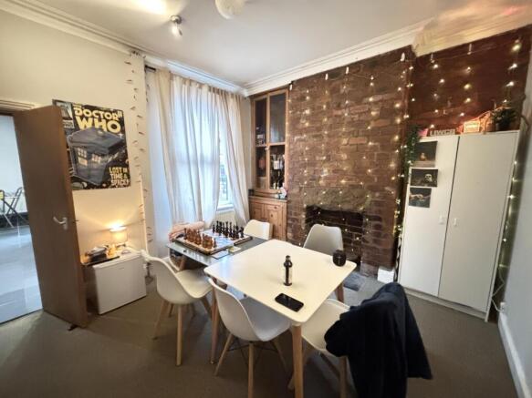 A modern, well-lit living room featuring a cozy...