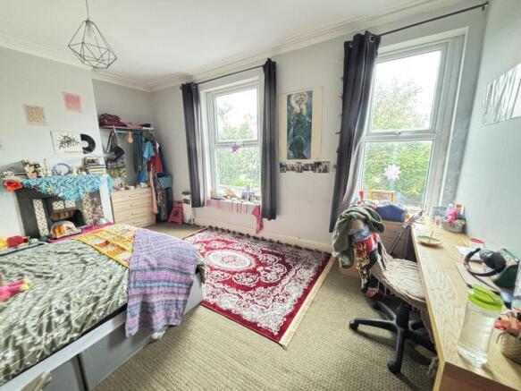 Bright and welcoming living room with large win...