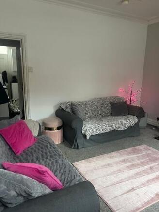 Bright and inviting living room featuring comfo...