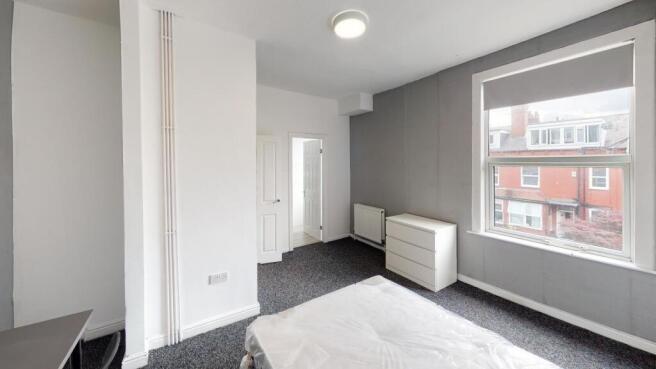 Bright and modern living room featuring large w...